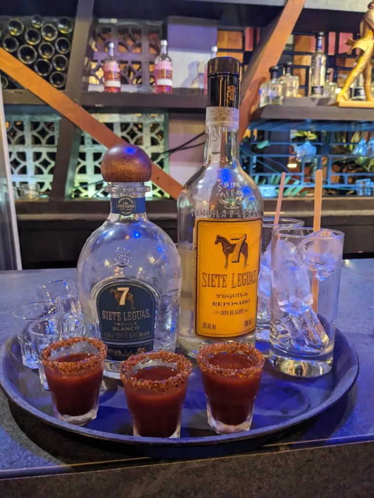 Tray with Siete Leguas bottles and sangrita